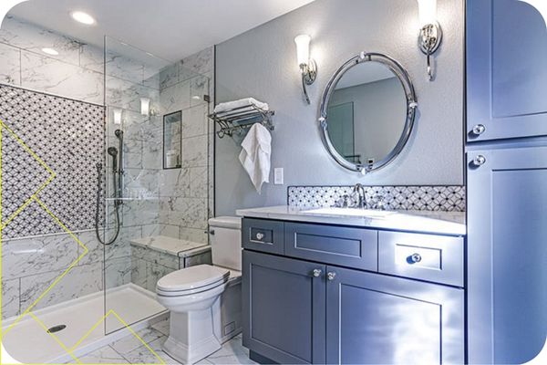 Hood County 2 Modern bathroom design featuring a glass shower, marble tile, dark cabinetry, and elegant fixtures, reflecting Mr. Roof Fix's home remodeling services in Hood County.